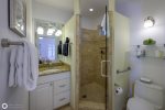  Bathroom vanity has a  granite top with a stainless steel sink